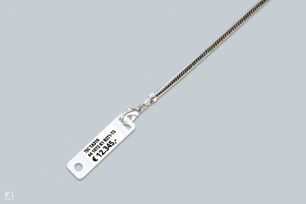 Haftetikett Ref.No. 41 1020/4 auf Ketten-Etikett Ref.-No. 73 33 2G als Träger-Etikett